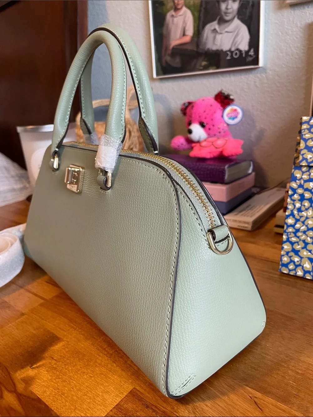The Kate Spade KK114 refers specifically to the Phoebe East West Satchel